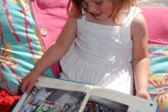 child reading outdoor portrait